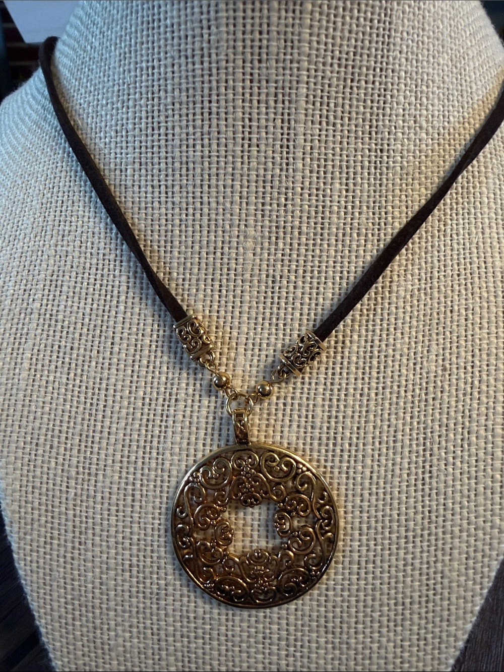 Lia Sophia Gold Filigree Round Medallion on Dark Brown Cord
